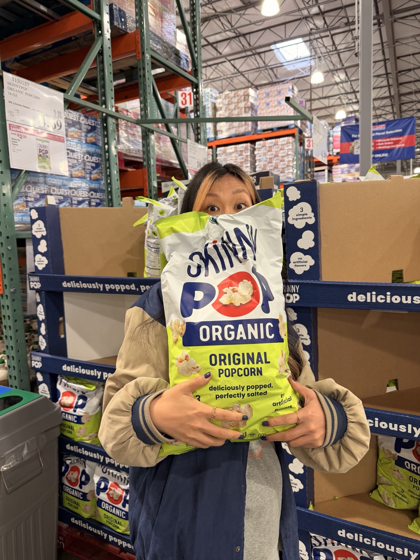 zzx holding an enormous bag of popcorn