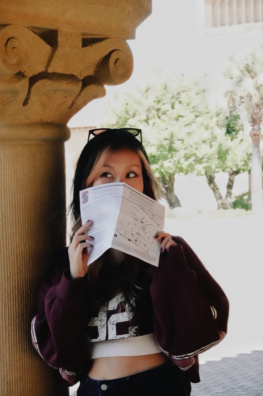 zzx peeking over a Stanford campus map
