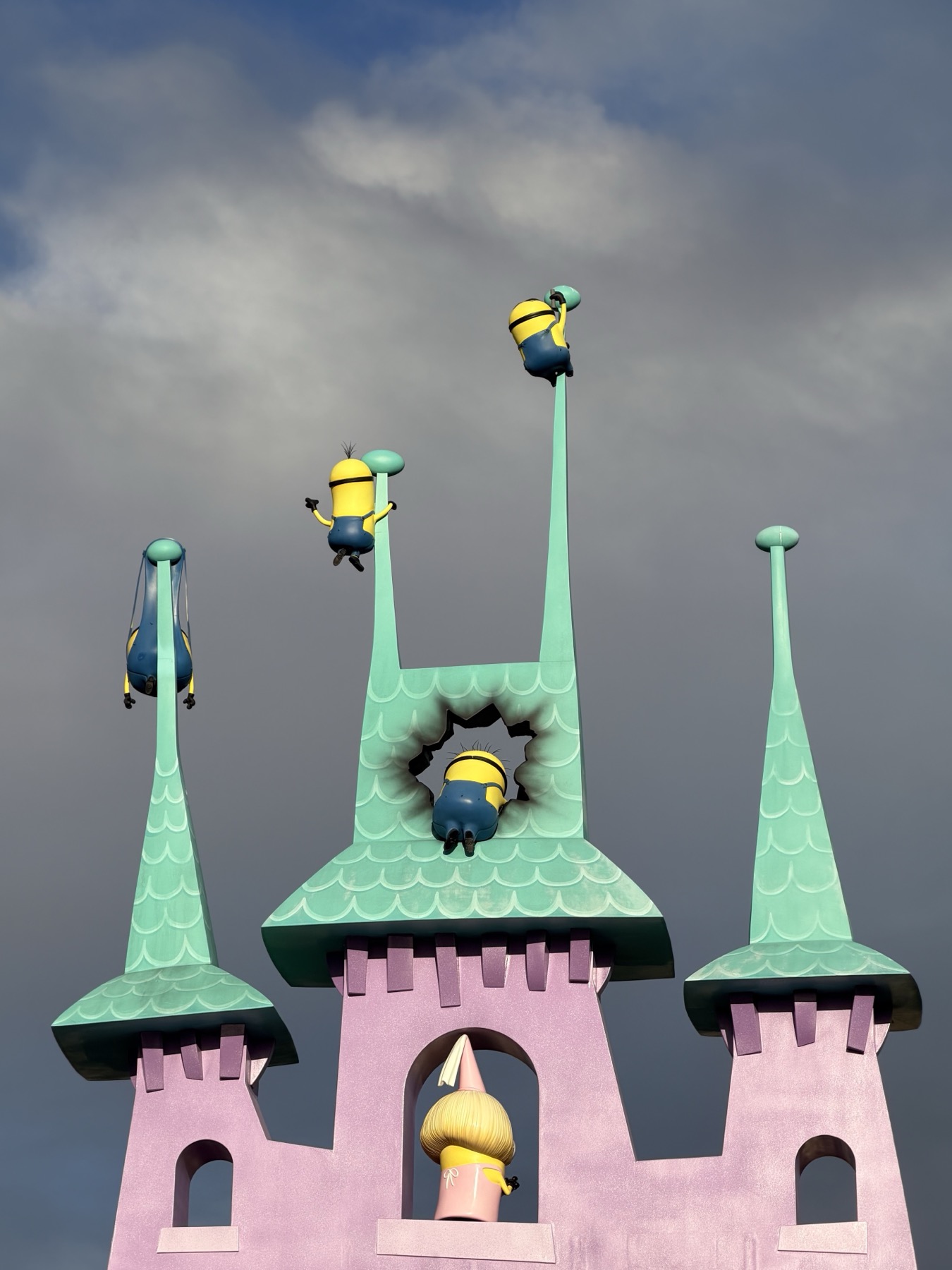 Minions tumbling over a pastel castle